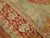 A large square early 20th-century antique Turkish Oushak rug with a light green field and red border. Full pile condition....