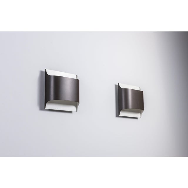 This elegant pair of Model 2030/31 wall lamps by Rolf Krüger and Dieter Witte for Staff Leuchten captures the essence of...