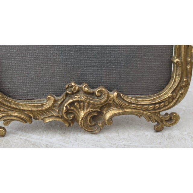 High-style bronze cast photo frame. Fine, deeply cast scrolling and curling design. Fitted with a replacement lacquered...