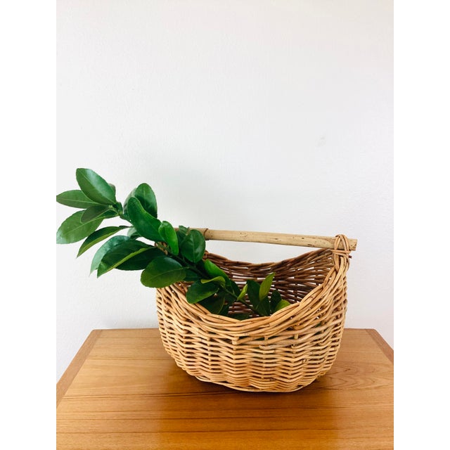 Vintage Woven Wicker / Reed Gathering Basket made of woven wicker/rattan type material bamboo handle natural color great...