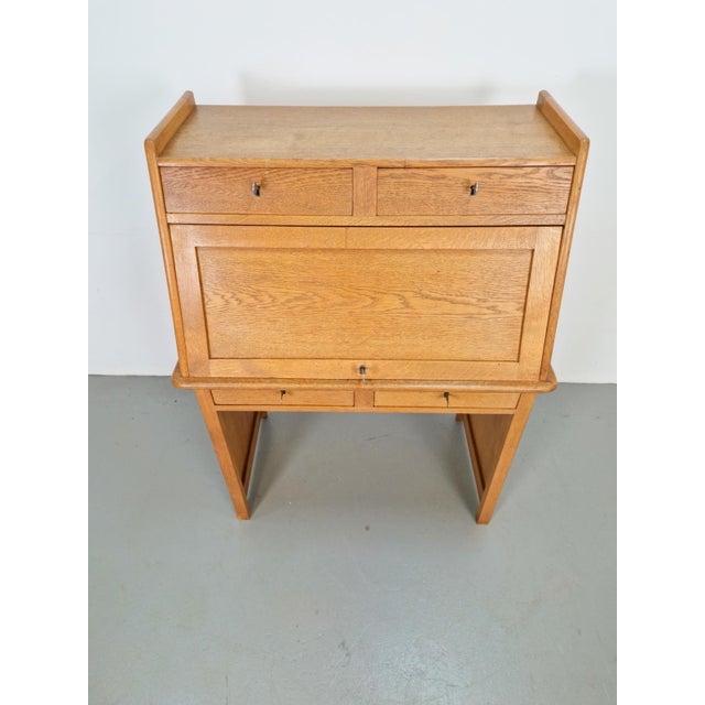 Art Deco Secretary in Natural Oak, 1930s A unique Art Deco secretary made of wood. This antique piece of furniture dates...