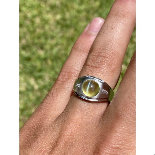 Top quality Chrysoberyl Cat's Eye mounted in a classy brushed white gold ring setting. Mystical and mysterious green Cats...