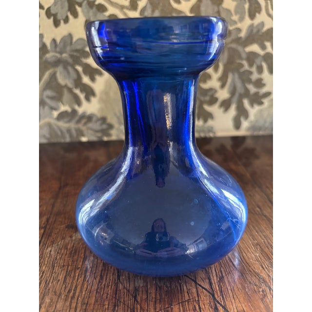 Mold blown blue glass American bulb forcing vase. Thick glass walls. On the heavier side. No cracks or rim chips.