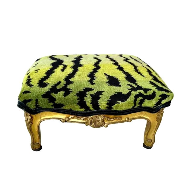 Elegant Louis XV Style Footstool features a finely carved giltwood frame with classic cabriole legs, scrolling aprons, and...
