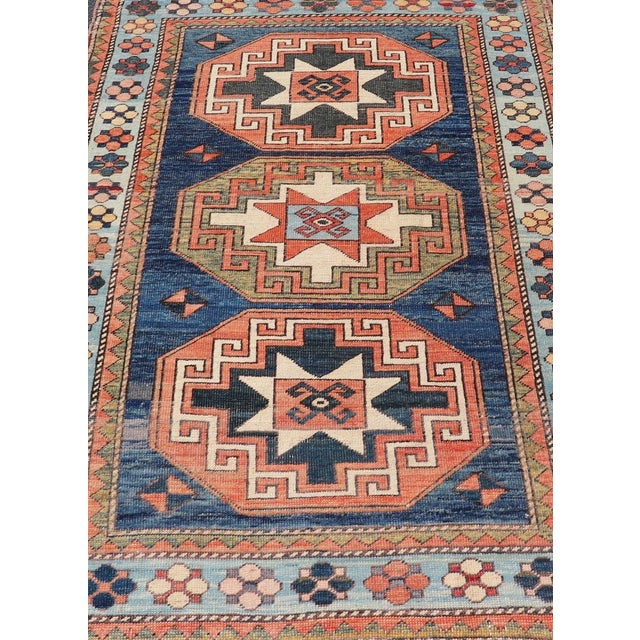 Measures: 4'6 x 6'10 This exquisite Vintage Turkish Oushak rug showcases a harmonious blend of rich colors and intricate...