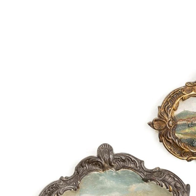 Porcelain - Three wall plaques. European, early 20th century, in polychrome and gilded terracotta, depicting landscapes....