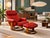 Details: Modern Fun ChairWorks Red Leather Upholstered Reclining Swivel Armchair and Ottoman, circular tripod bases, each...