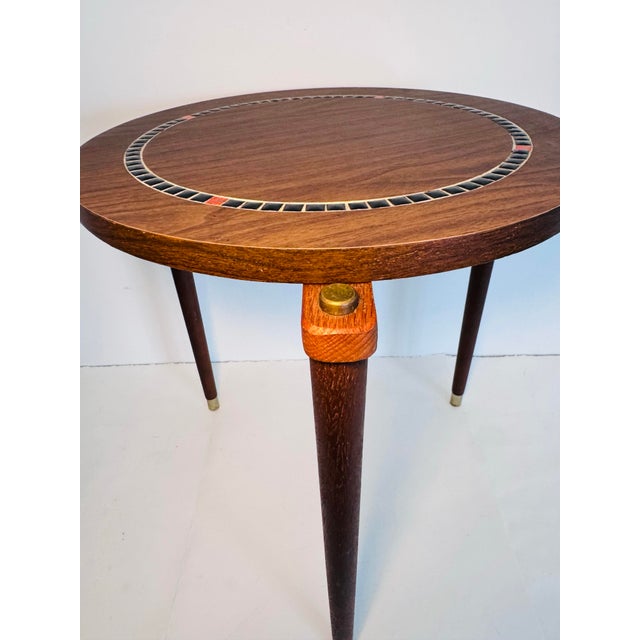 Vintage 1960s Round Side Table With Tile Top Accent Teak Legs. Top of the table is a mix of laminate and tile. The base is...