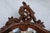 A striking antique French batwing mirror featuring beautifully figured quarter-sawn tiger oak, an elegantly carved crest,...