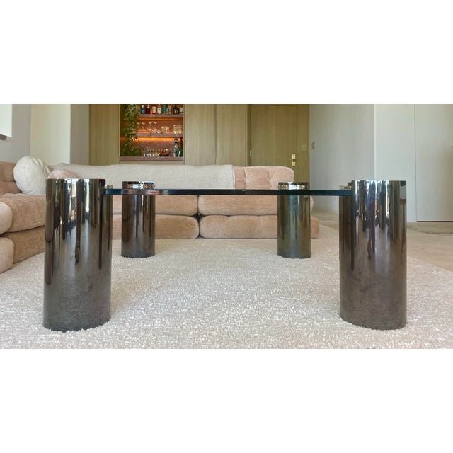 Elevate your interior with this rare and monumental-sized Karl Springer “Sculpture” coffee table, a stunning example of...