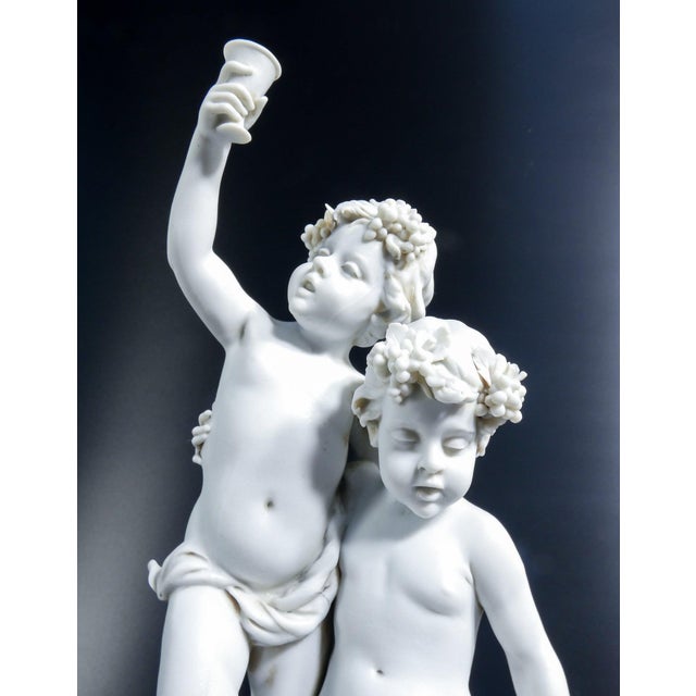 Biscuit porcelain sculpture signed benacchio, from the triade factory, bacchanalian putti. Bassano, italy, 1970s origin...