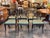A set of six 19th century black and gilt side chairs, each with a gently curved crest rail carved as a gilded rope twist...