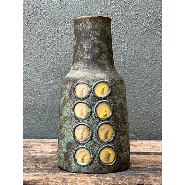 Elevate your space with this exceptional Mid-Century Modern West German studio pottery vase. Reflecting the bold...