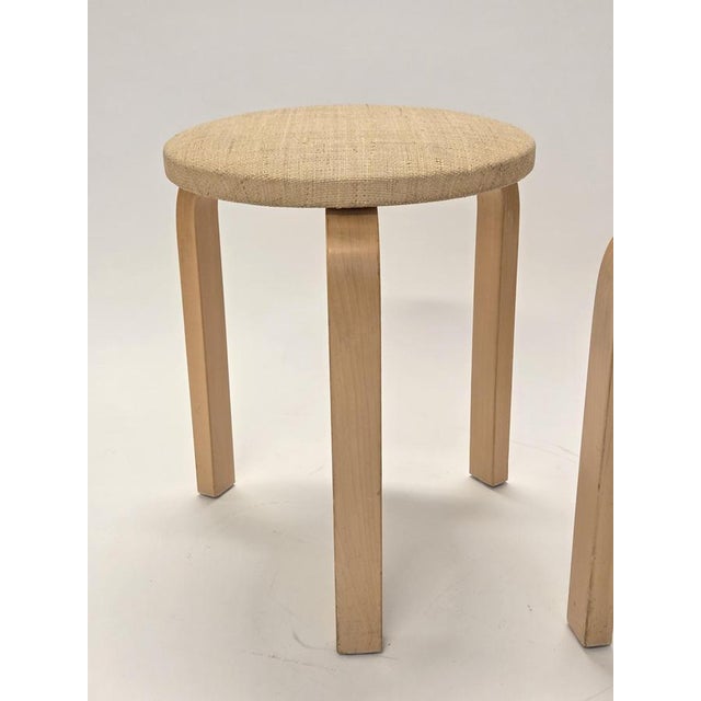 Artek 60 stools, 2 pcs. Birch with beige bast fabric upholstery. The stools are from around the 1960s and in good used...