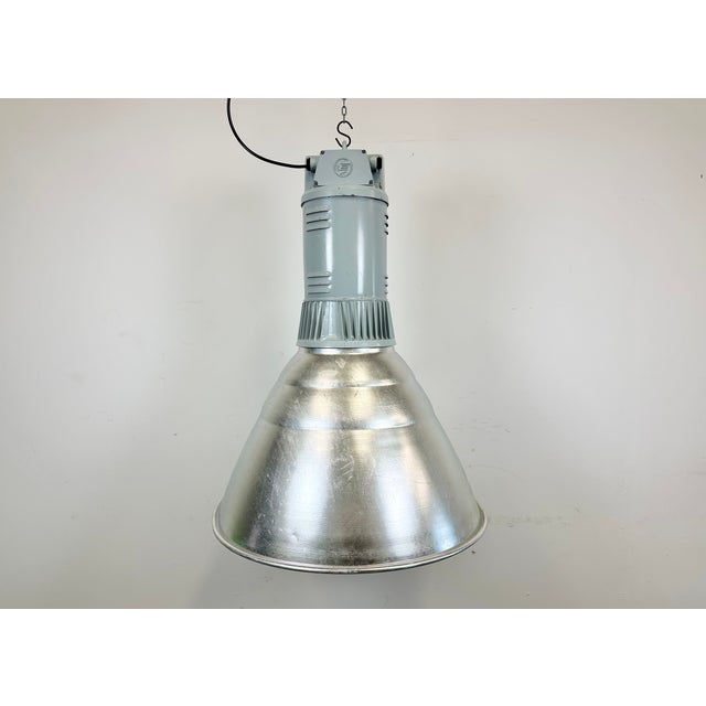 This pendant lamp was made by Elektrosvit and originally used in a factories in former Czechoslovakia in the 1960s. The...