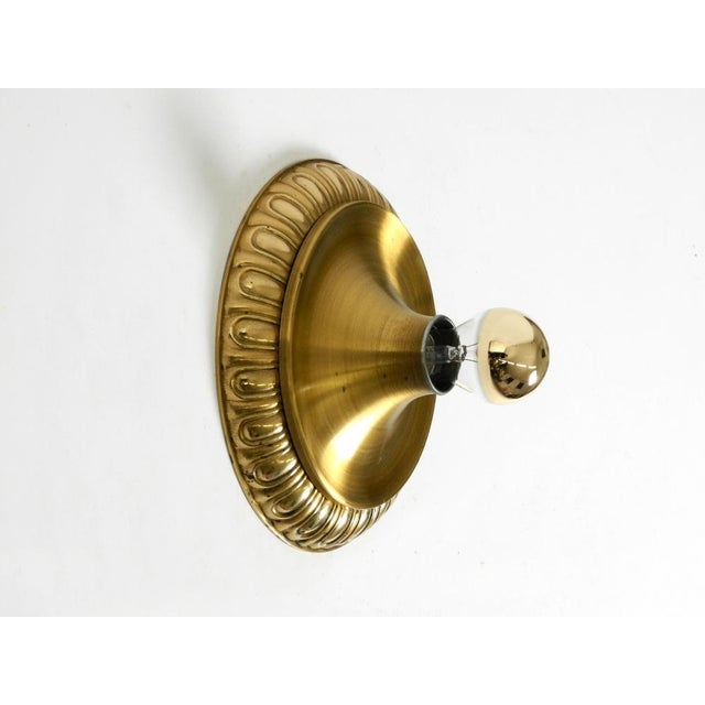 Fancy 1960's space age pop art round wall lamp. manufacturer is sölken lights. Made in germany. the outer ring is made of...