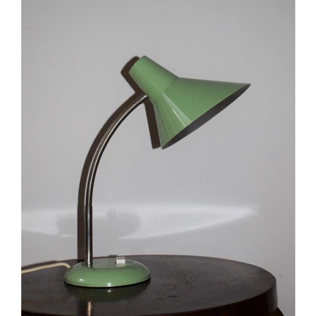 Desk lamp very well preserved with gooseneck. I have official proof of authenticity such as vintage catalogs, designer...