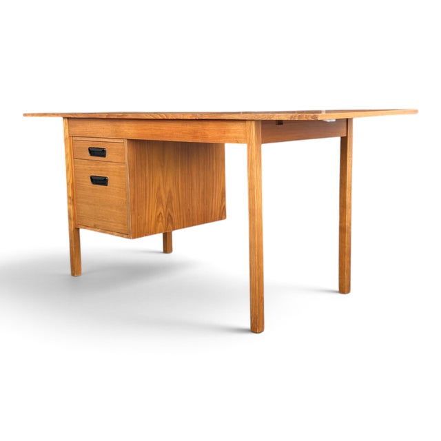 Designed with versatility at its core, this vintage Mid-Century Modern teak desk pairs a beautifully streamlined profile...