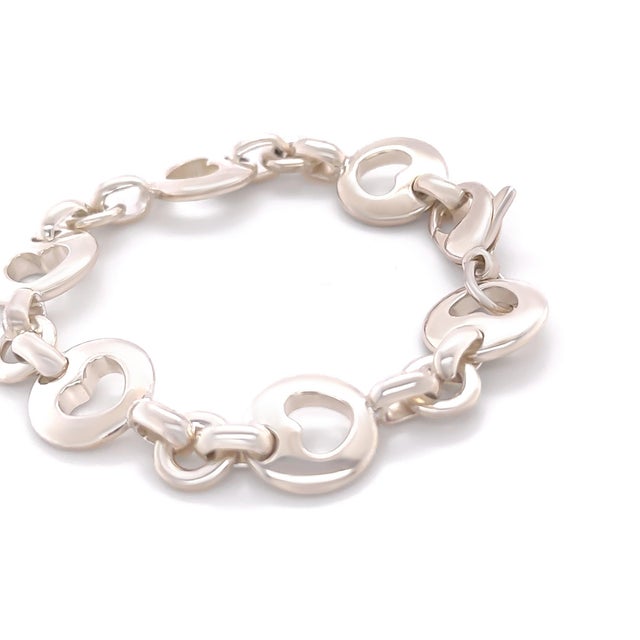 A rare vintage Tiffany & Co. Stencil Heart Link bracelet crafted in sterling silver, featuring a refined chain design...