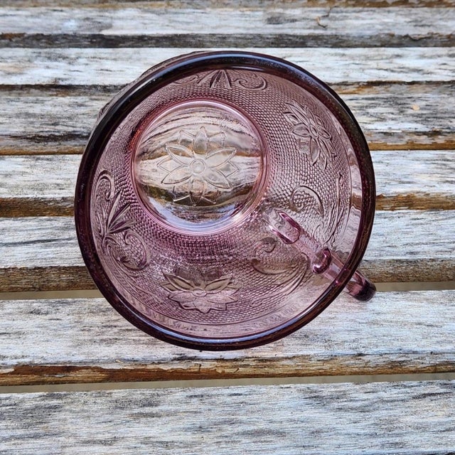 Add a touch of vintage charm to your drinkware collection with this gorgeous moody plum purple glass tea cup by Indiana...