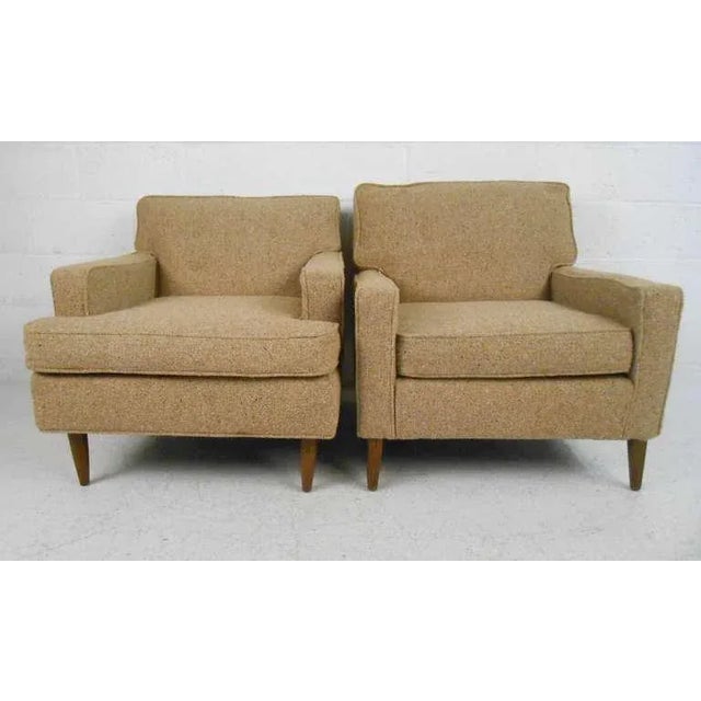 Stylish midcentury club chairs offer comfortable seating proportions with classic vintage look. Perfect pair for home or...