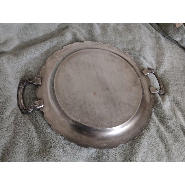 Gorgeous elaborate round silverplate waiter's tray. Ornate rose and floral trim on the scalloped edge and matching...