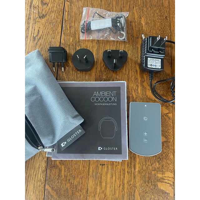 Minimalist solar powered outdoor light w/ remote control. The lantern is made of a polyethylene body with a natural teak...