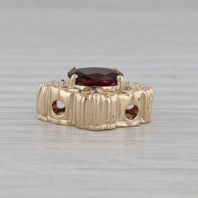 Gemstone Information: - Natural Garnet - Carats - 2.20ct Cut - Oval Color - Red Metal: 14k Yellow Gold Weight: 5.3 Grams...