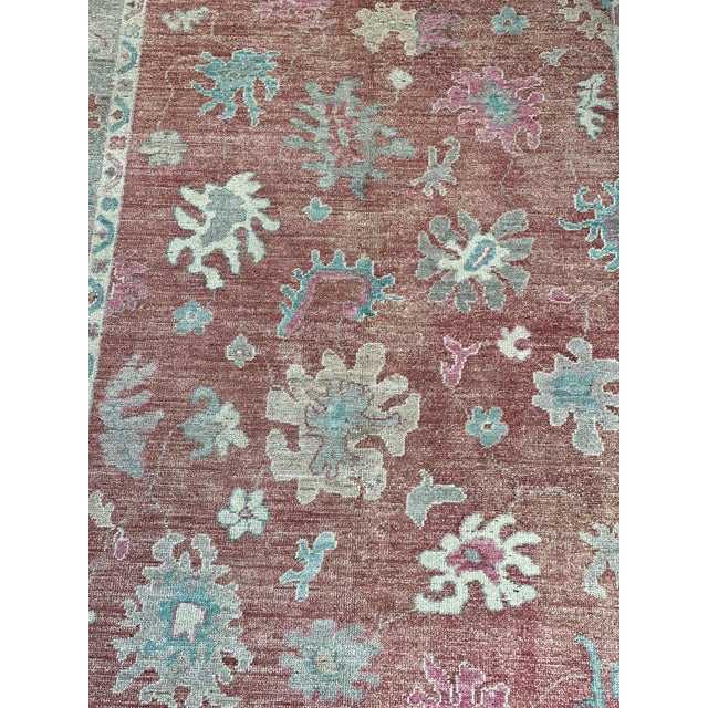 This is a great example of hand knotted village rug weaving. A replication of an antique Oushak in soft and decorative...