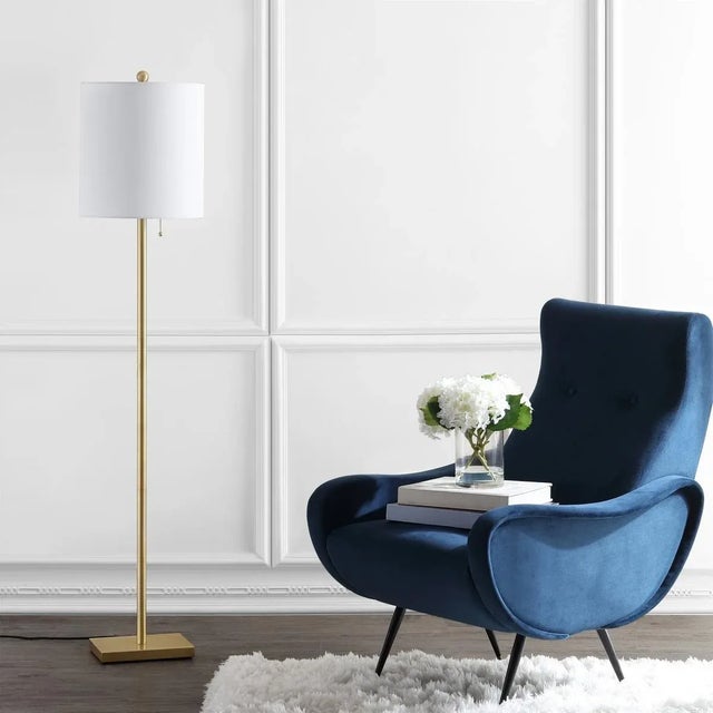 Illuminate your space with the Octavius floor lamp, a 61-inch masterpiece that combines elegance and functionality. Made...