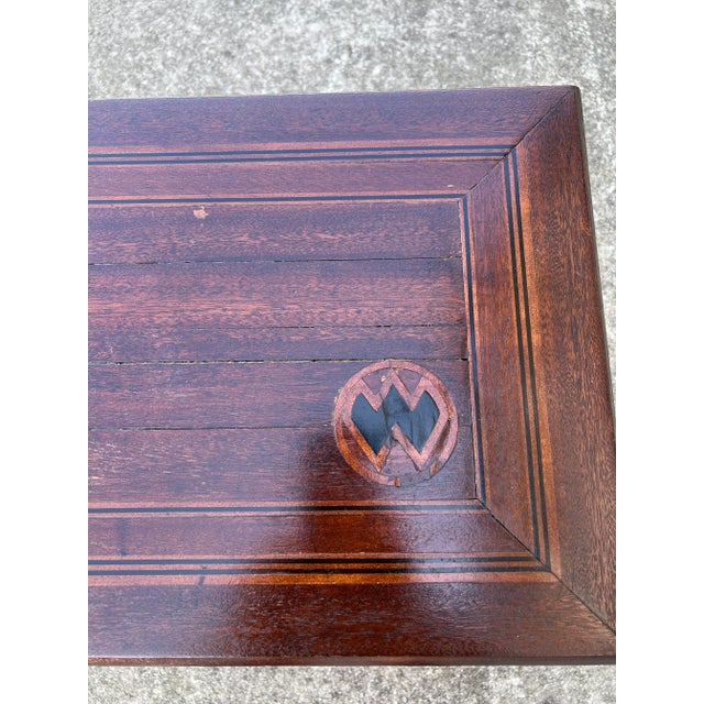 English Side Table with Turned Legs . Table is in a Dark Stained Color and guessing the mark on Top is a makers mark .