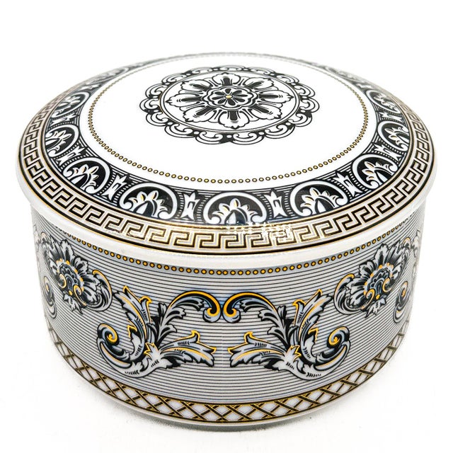 Elevate your vanity, desk, or display cabinet with this striking vintage porcelain covered box from the celebrated...