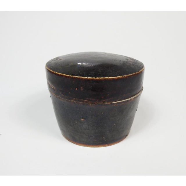 Small mid 20th century handmade brown glaze pottery bowl or jar with lid. Unsigned.