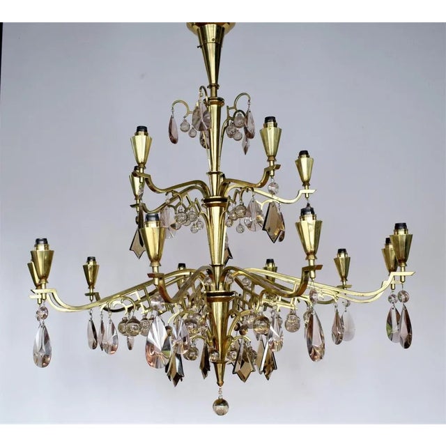 Exceptionally representative chandelier: Around 100 crystal glass elements: transparent balls of different sizes; Sixted...