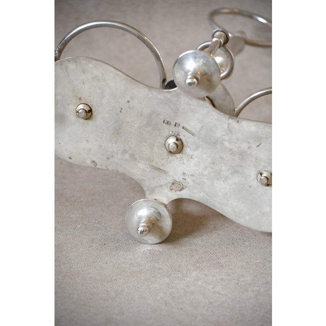 An elegant antique Christofle silver-plated oil and vinegar cruet holder, crafted in France as a refined piece of...