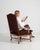 A armchair whose dark carved wood frame, burgundy/maroon upholstery gives it real character at first glance. The piece...