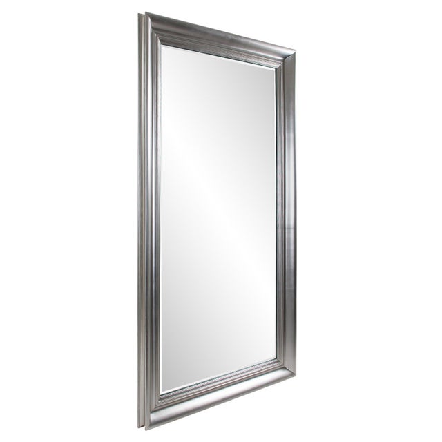 The Tierney oversized mirror features a beautifully handcrafted sculpted wooden frame in a bright silver leaf finish. The...
