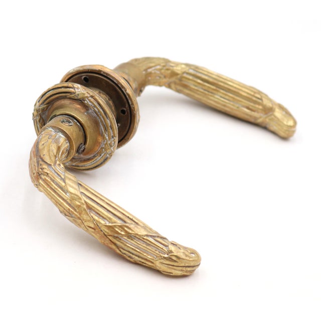 French style brass door lever set with a polished finish and matching rosettes. Priced as two levers, two rosettes, and a...