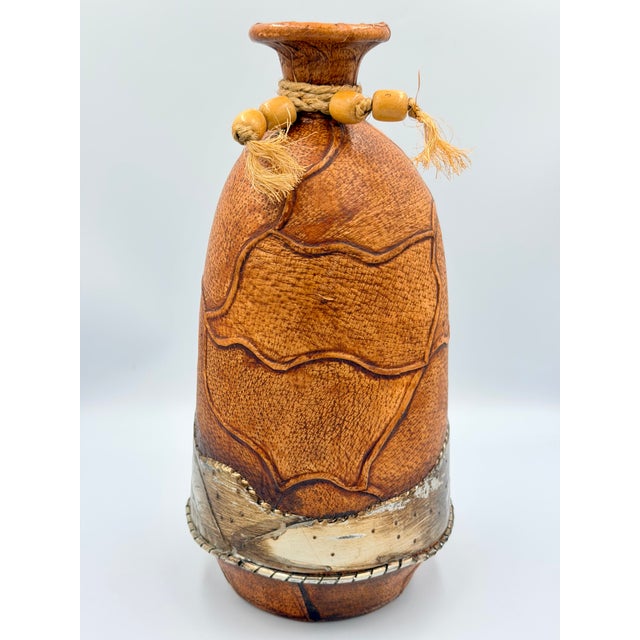 Discover this truly unique vintage Mexican bud vase, a beautiful piece that effortlessly captures the spirit of...