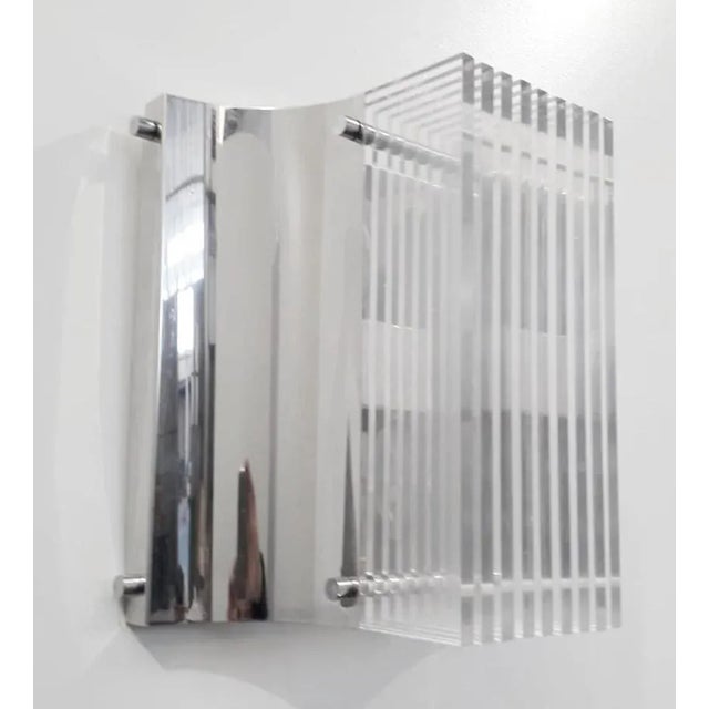 Italian mid-century Lucite wall lights mounted on polished chrome frames / Made in Italy circa 1960s Can also be stacked...