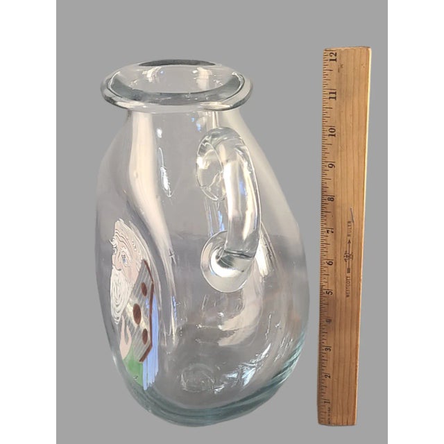 This antique hand-blown glass pitcher is a stunning piece of Judaica art. The pitcher has been beautifully hand-painted...