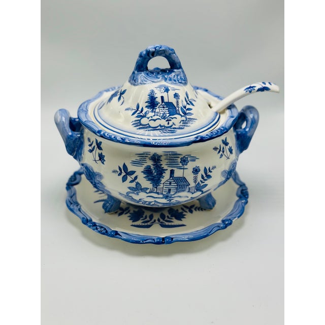 This charming blue and white piece appears to be a vintage covered soup tureen or condiment server with underplate and...