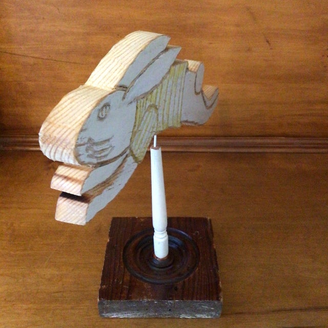Made from pine shelving out of a 1930s built-in, this bounding rabbit, is mounted on top of a Victorian redwood door...