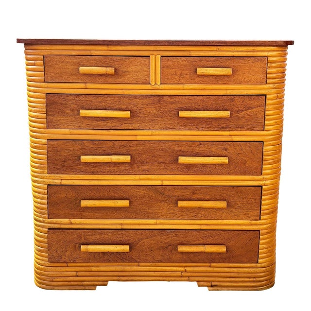 This beautifully restored coastal Art Deco era rattan chest of drawers with a mahogany top and six pull-out mahogany...