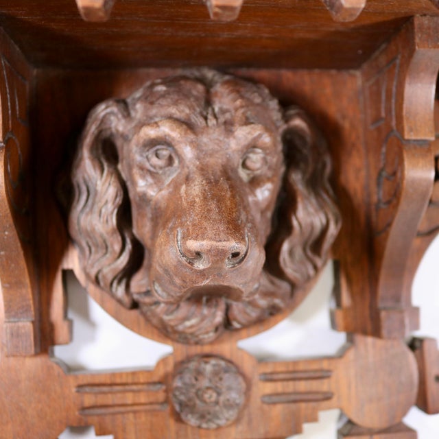 An exceptionally fine and charming 19th-century European Black Forest style hand-carved wooden wall bracket shelf. This...