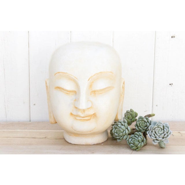 Behold this exquisite Buddha statue, meticulously carved from pristine white marble, radiating serenity. With a...