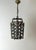Decorative European hanging lantern dating from the 1960s or 1970s, crafted from solid cast brass with a beautifully aged,...