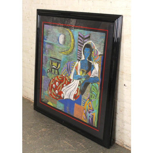 Large scale mixed media on paper, showing a woman seated. Beautiful coloring set in a black frame.