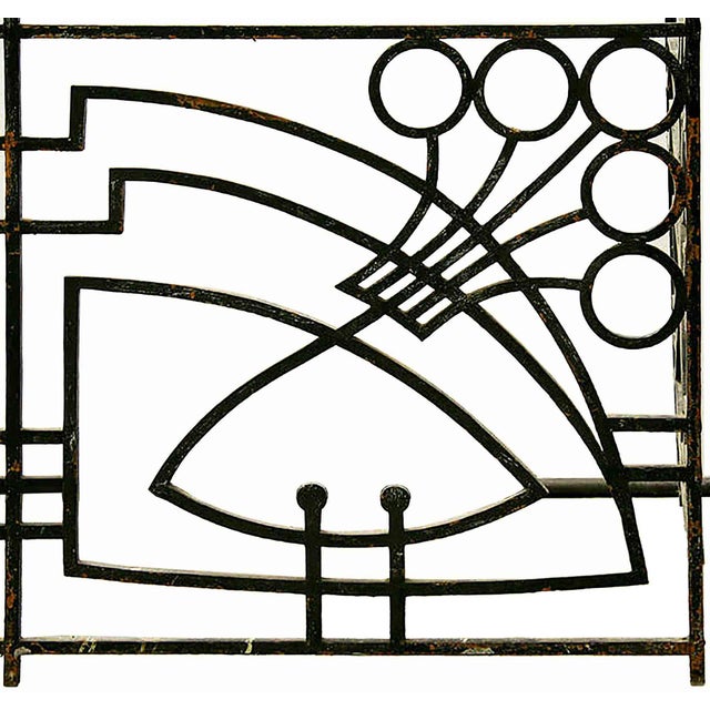 Antique French Art Nouveau style wrought iron and bronze balcony having bronze rails over highly stylized front panel and...