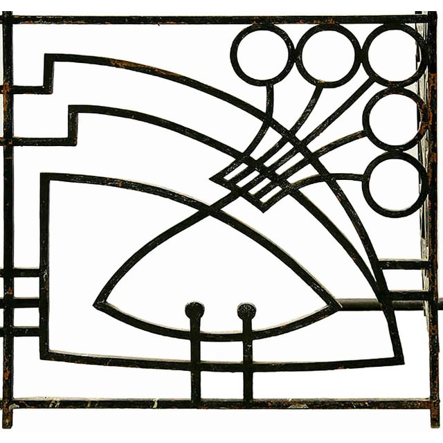 Antique French Art Nouveau style wrought iron and bronze balcony having bronze rails over highly stylized front panel and...